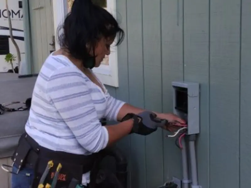 Licensed electrician wiring an exterior subpanel in Mendota