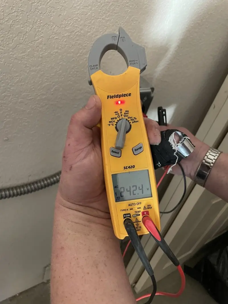 Voltage testing with clamp meter during Recessed Lighting Installation in Mendota